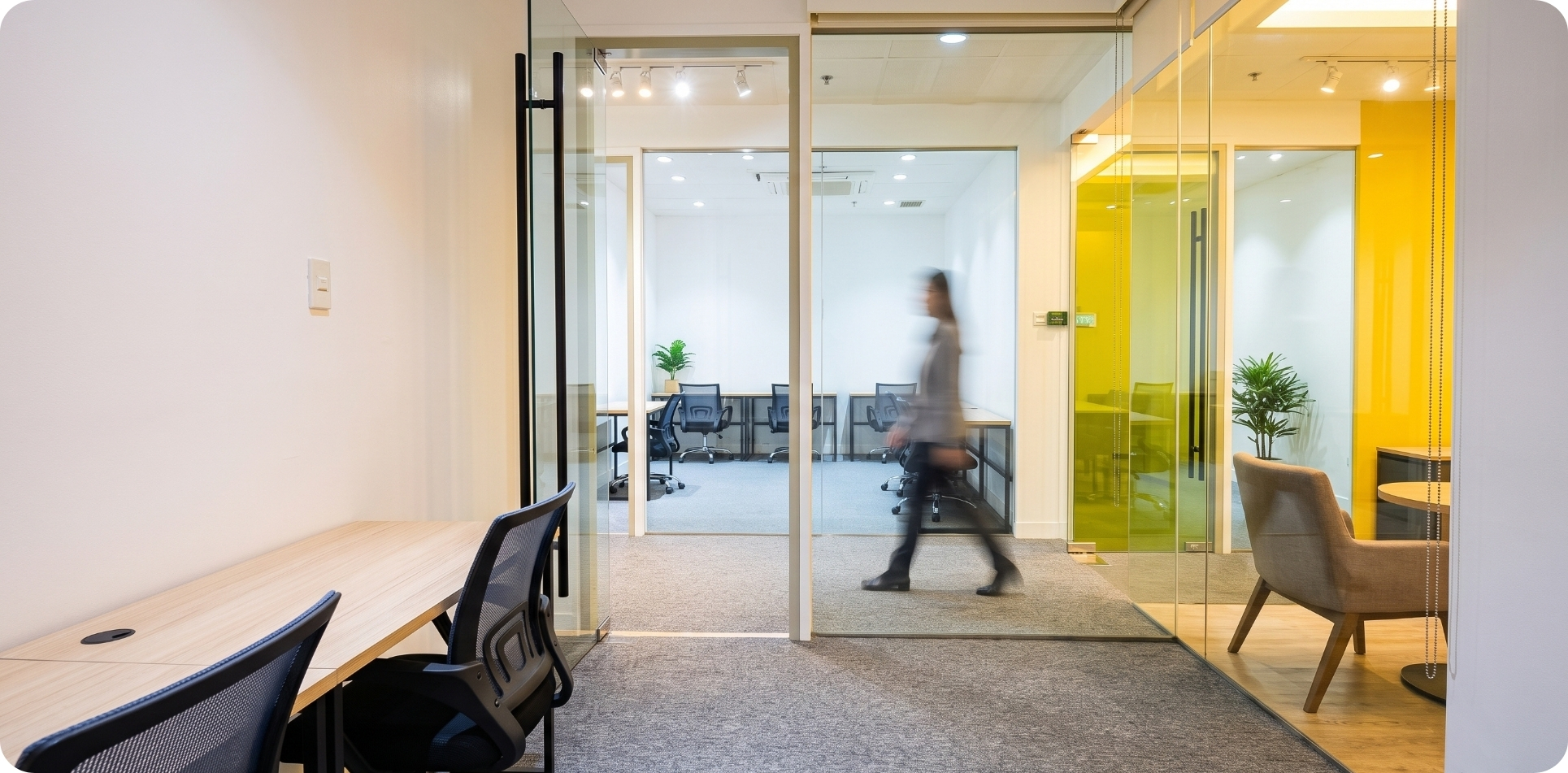 Glass-walled private office corridor at Zero-Ten Park's Makati coworking space