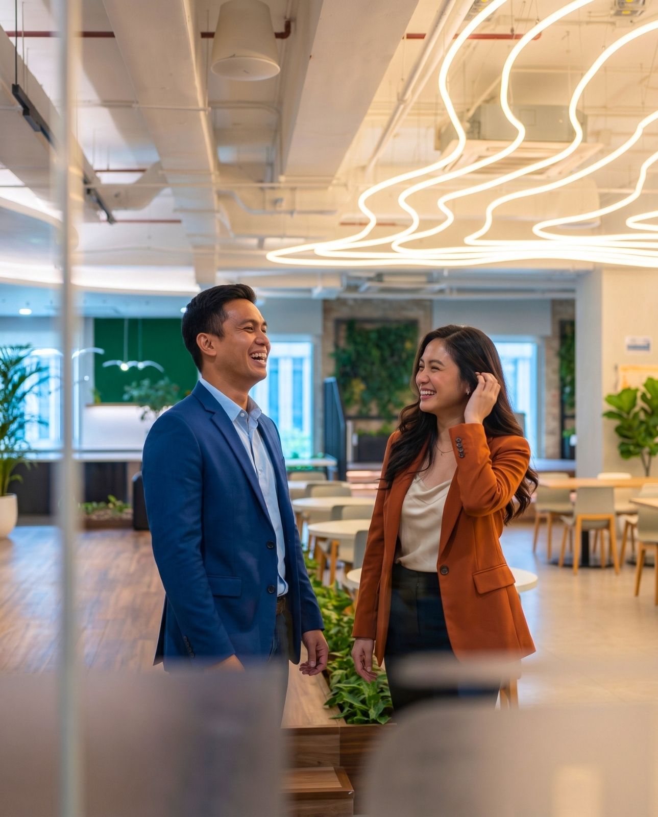 Colleagues sharing a laugh in the lounge area at Zero-Ten Park's BGC office