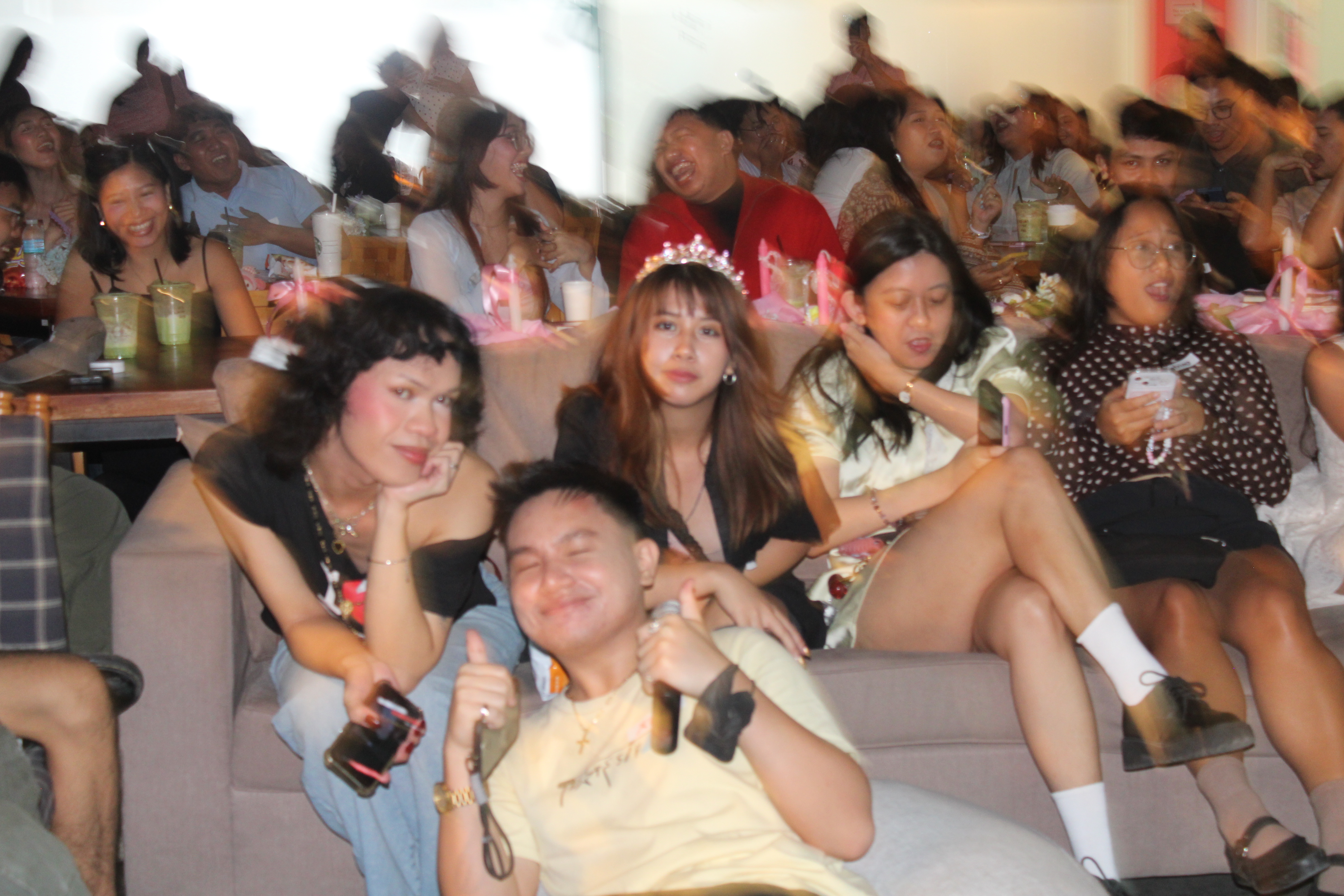 Attendees singing along at the Olivia Rodrigo listening party at a co-working space in Cebu